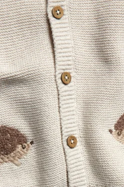 Baby beige knitted cardigan with hedgehog motif