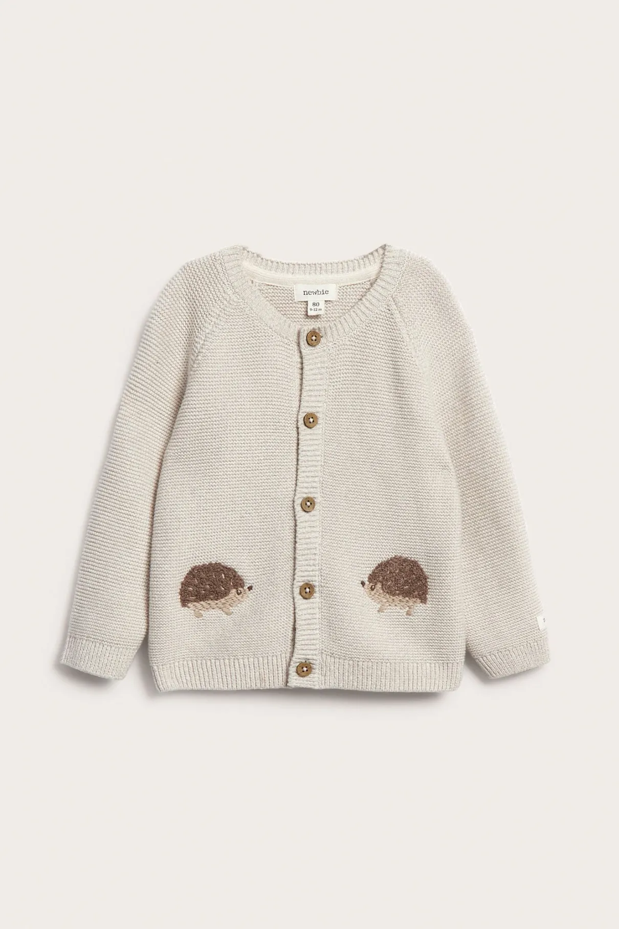 Baby beige knitted cardigan with hedgehog motif