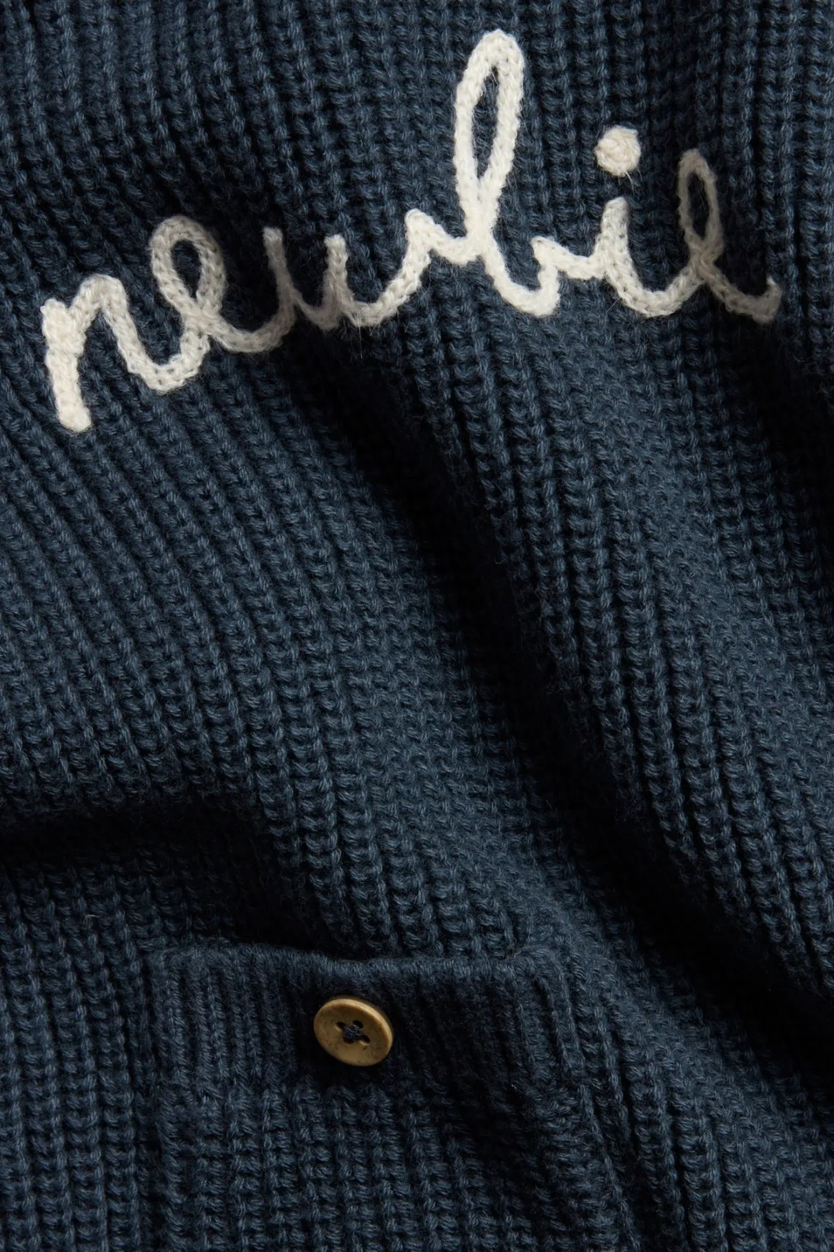 Baby blue knitted jumper with Newbie logo