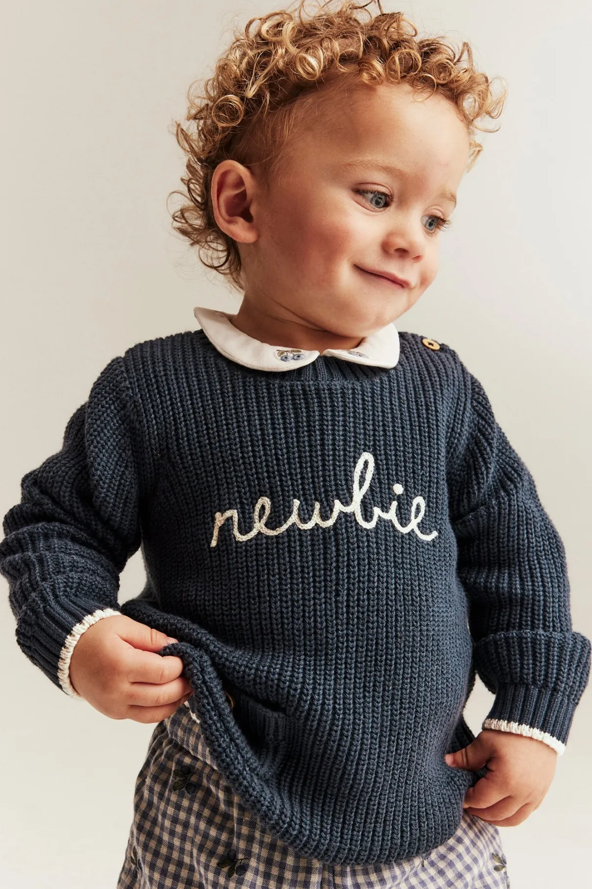 Baby blue knitted jumper with Newbie logo