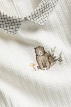 Baby bodysuit with checked collar