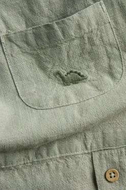 Baby green dinosaur dungarees
