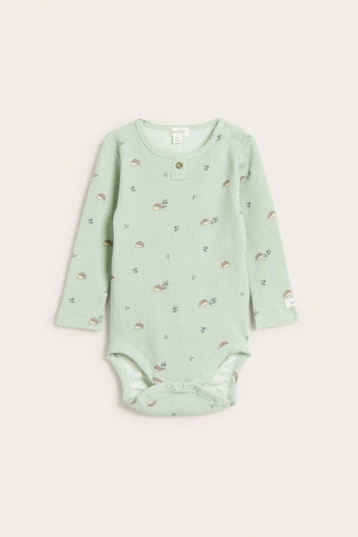 Baby green hedgehog-patterned bodysuit