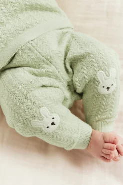 Baby green knitted leggings with rabbit appliqué