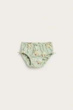 Baby green swim bottoms with dinosaur print