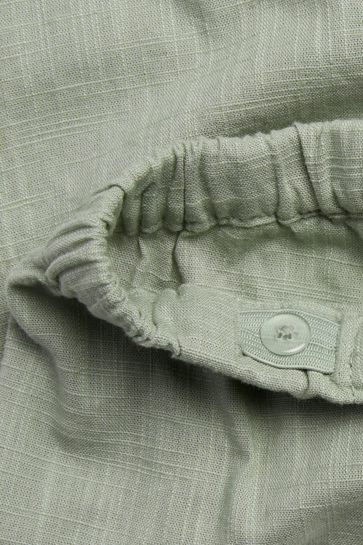 Baby green textured woven trousers