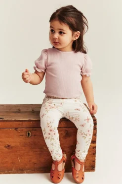 Baby pink bodysuit with short puff sleeves