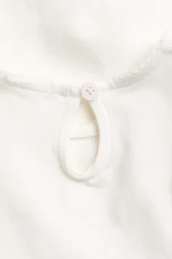 Baby white bodysuit with frills