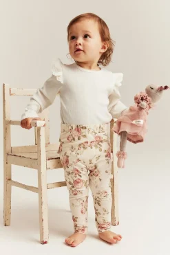 Baby white bodysuit with ruffles