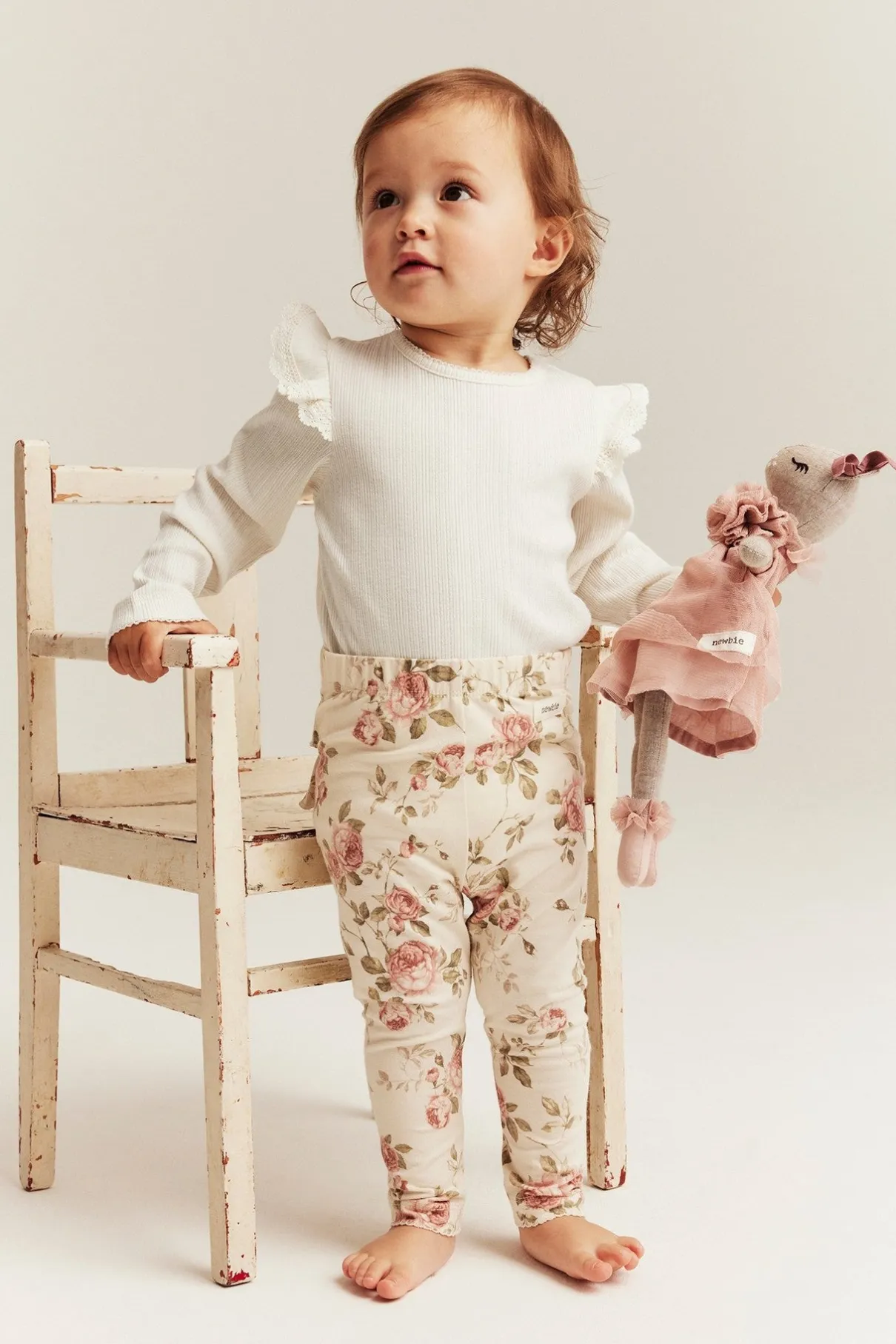 Baby white bodysuit with ruffles