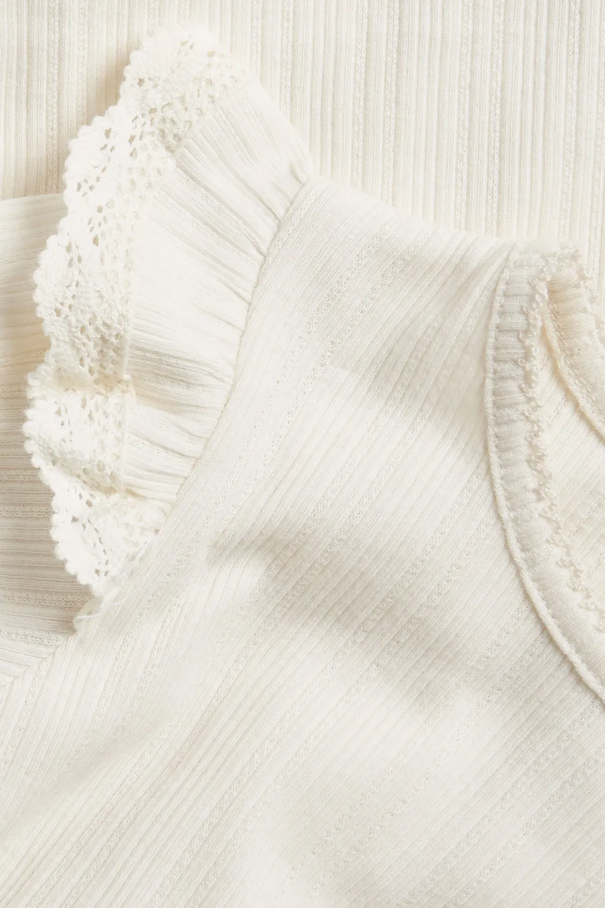 Baby white bodysuit with ruffles