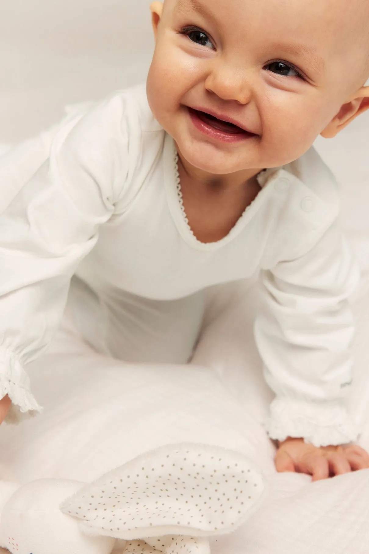 Baby white lace-cuff bodysuit