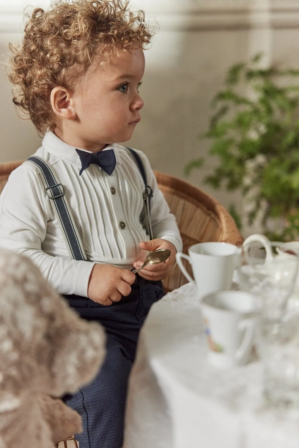 Baby white long-sleeved bodysuit with bow tie
