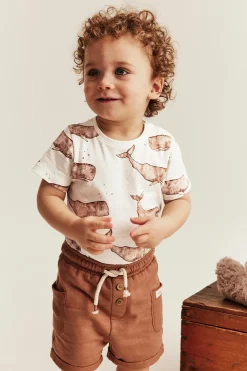 Baby white whale‑print bodysuit