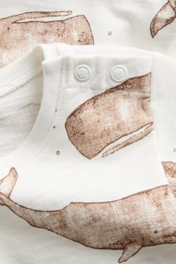 Baby white whale‑print bodysuit