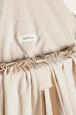 Beige reading tent with pom poms