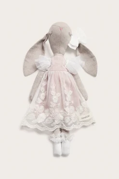 Cuddly beige toy rabbit with tutu
