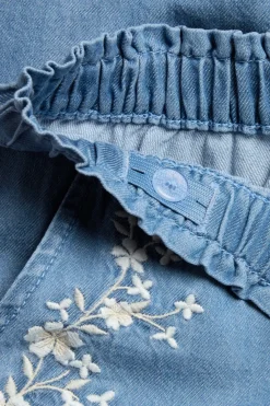 Kids blue denim trousers with floral embroidery