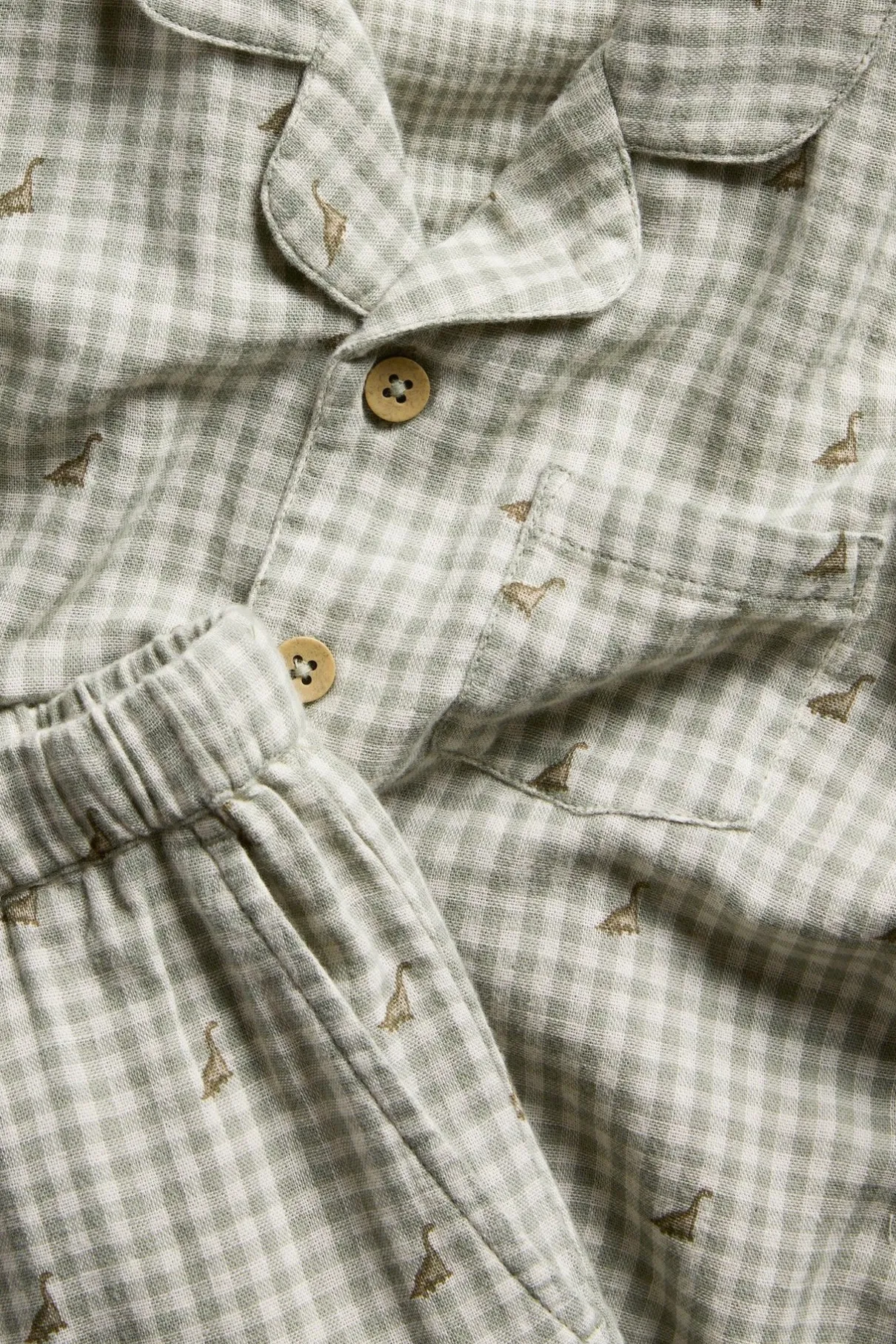 Kids checked pyjama with dinosaurs