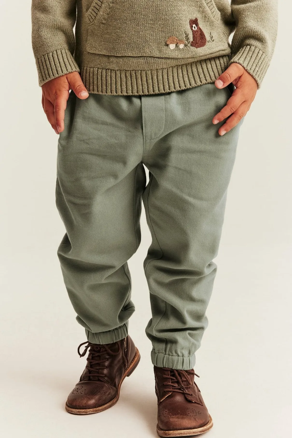 Kids green trousers with embroidery