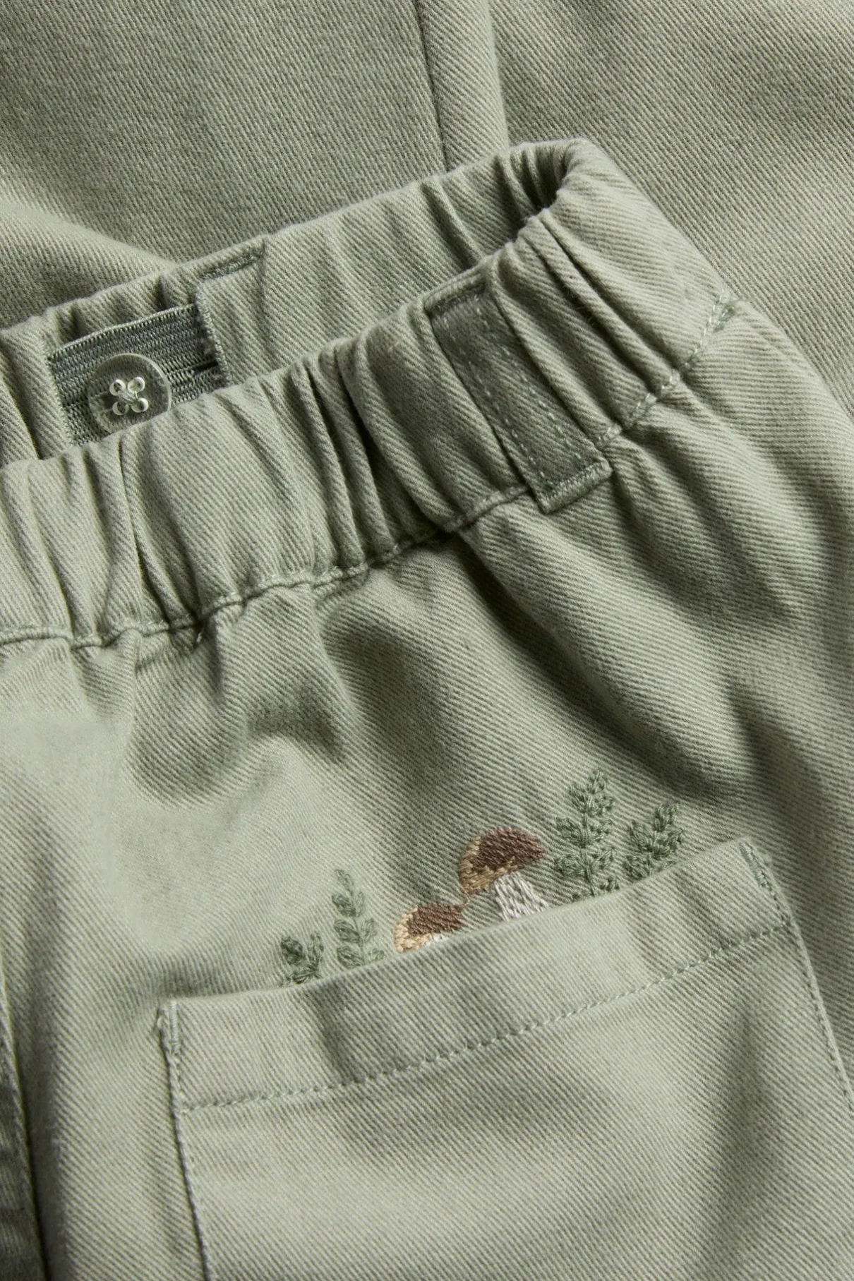 Kids green trousers with embroidery