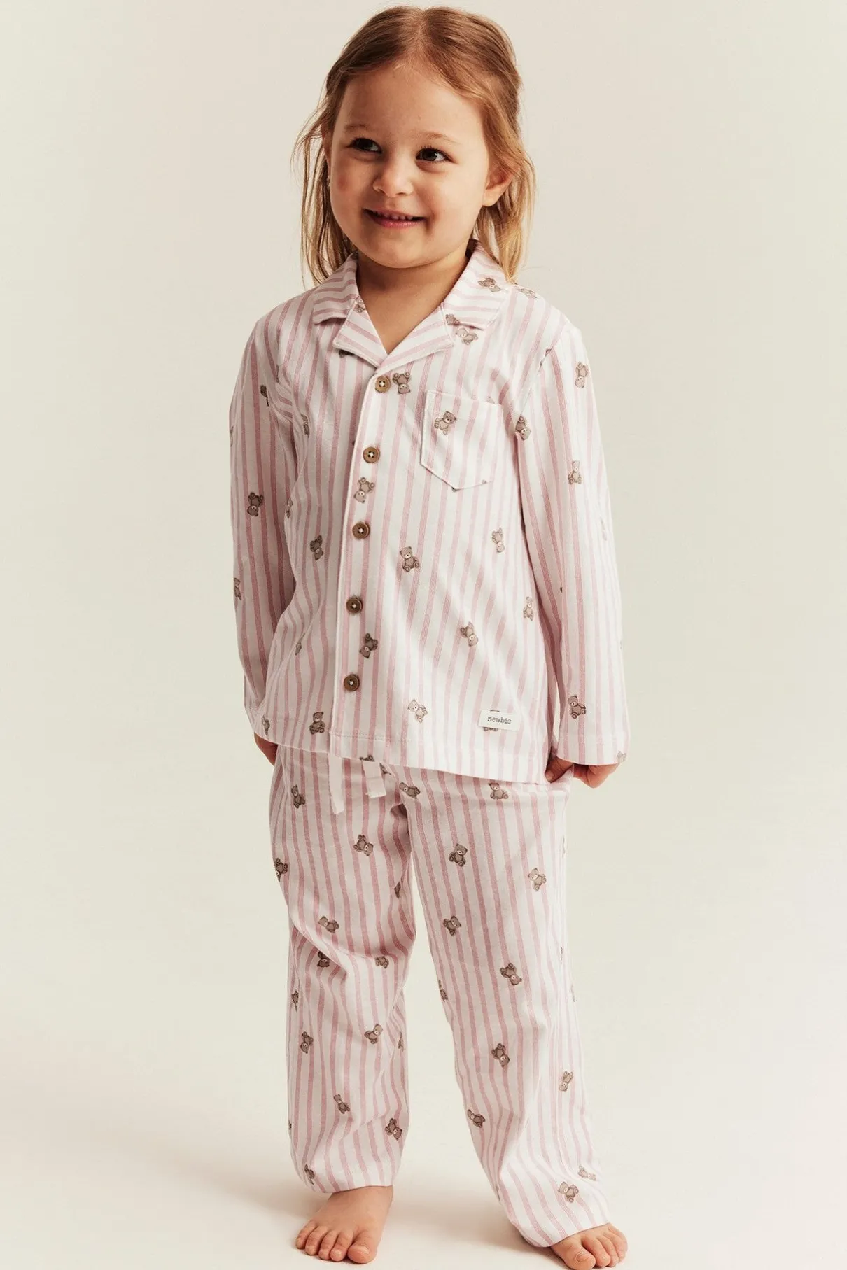 Kids striped pajamas with teddy bear motif