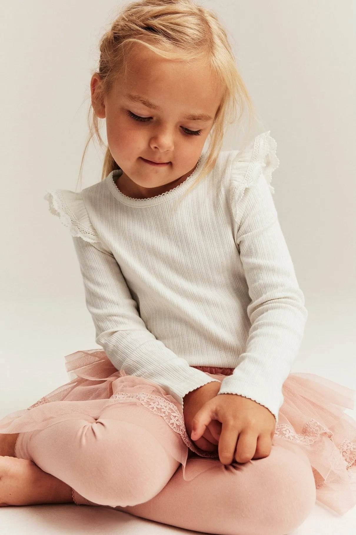Kids white ribbed top with frills