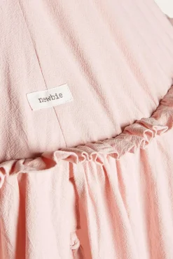 Pink reading tent with pom-poms