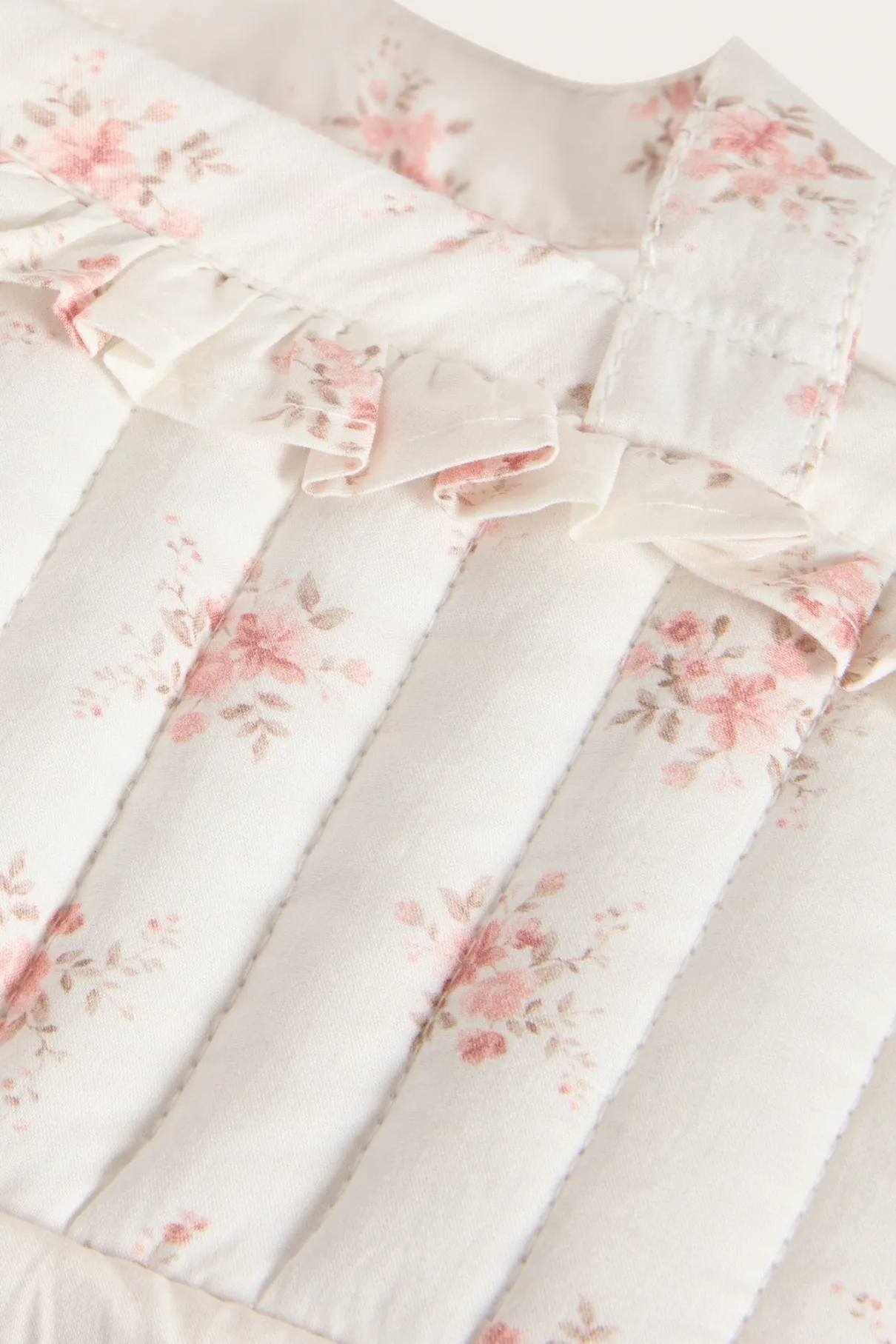 White floral quilted basket for dolls
