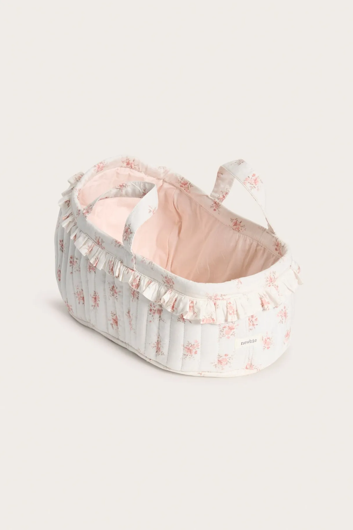 White floral quilted basket for dolls
