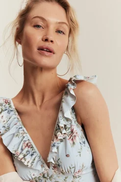 Women's blue floral swimsuit with frill detail