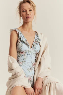Women's blue floral swimsuit with frill detail